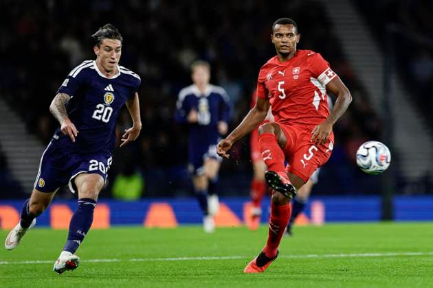 Scotland v Switzerland UEFA Nations League Kieron Bowie of Scotland and Manuel Akanji of Switzerland during the UEFA Nations League Group B1 match at Barclays Hampden, Glasgow 29 09 2026 UK Newspapers OUT Copyright: xJamiexJohnstonx FIL-24011-0074