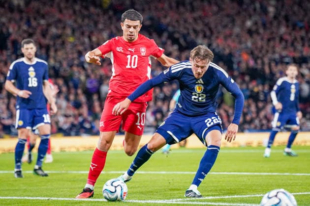 Soccer: UEFA Nations League 2026–2027, Matchday 2: Scotland vs. Switzerland at Hampden Park, Glasgow—Nathan Patterson (Scotland, 22) and Zeki Amdouni (Switzerland, 10) Copyright: xJOERANxSTEINSIEKx