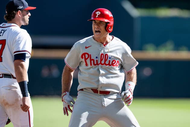 J.T. Realmuto 10 of the Philadelphia Phillies celebrates after sliding into third base in the seventh inning against the Atlanta Braves in game one of the MLB, Baseball Herren, USA National League Wild Card round at Truist Park on Tuesday, September 29, 2026 in Atlanta, Georgia.  ATL20260928121 JULIANxALEXANDER