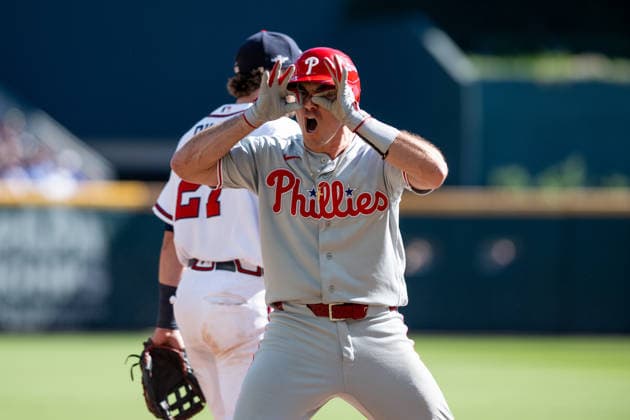 J.T. Realmuto 10 of the Philadelphia Phillies celebrates after sliding into third base in the seventh inning against the Atlanta Braves in game one of the MLB, Baseball Herren, USA National League Wild Card round at Truist Park on Tuesday, September 29, 2026 in Atlanta, Georgia.  ATL20260928122 JULIANxALEXANDER