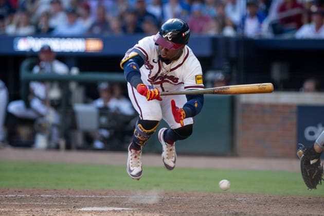 Ozzie Albies 1 of the Atlanta Braves jumps to avoid a pitch before being walked to first base in the eighth inning against the Philadelphia Phillies in game one of the MLB, Baseball Herren, USA National League Wild Card round at Truist Park on Tuesday, September 29, 2026 in Atlanta, Georgia.  ATL20260928126 JULIANxALEXANDER