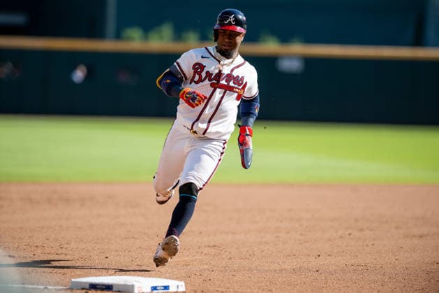 Ozzie Albies 1 of the Atlanta Braves rounds third base after a home run by Austin Riley 27 of the Atlanta Braves in the eighth inning against the Philadelphia Phillies in game one of the MLB, Baseball Herren, USA National League Wild Card round at Truist Park on Tuesday, September 29, 2026 in Atlanta, Georgia.  ATL20260928129 JULIANxALEXANDER