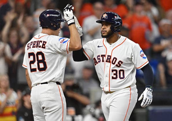 Houston Astros Nelson Velazquez (30) celebrates with Lucas Spence (28) after hitting a solo home run against the Chicago White Sox in the fifth inning in an MLB, Baseball Herren, USA American League Wild Card game in Houston, Texas, on Tuesday, September 29, 2026.  HOU20260929734 MARIAxLYSAKER