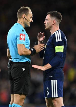 Glasgow, Scotland, 29th September 2026. Referee Nenad Minakovic and Andrew Robertson of Scotland during the Scotland vs Switzerland UEFA Nations League match at Hampden Park, Glasgow. Picture credit should read: Neil Hanna Sportimage EDITORIAL USE ONLY. No use with unauthorised audio, video, data, fixture lists, club league logos or live services. Online in-match use limited to 120 images, no video emulation. No use in betting, games or single club league player publications. SPI_077_Scotland_Switzerland SPI-5047-0077