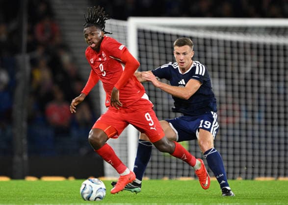 Glasgow, Scotland, 29th September 2026. Johan Manzambi of Switzerland and Lewis Ferguson of Scotland during the Scotland vs Switzerland UEFA Nations League match at Hampden Park, Glasgow. Picture credit should read: Neil Hanna Sportimage EDITORIAL USE ONLY. No use with unauthorised audio, video, data, fixture lists, club league logos or live services. Online in-match use limited to 120 images, no video emulation. No use in betting, games or single club league player publications. SPI_125_Scotland_Switzerland SPI-5047-0125