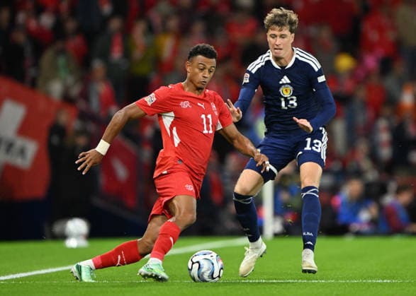 Glasgow, Scotland, 29th September 2026. Dan Ndoye of Switzerland and Jack Hendry of Scotland during the Scotland vs Switzerland UEFA Nations League match at Hampden Park, Glasgow. Picture credit should read: Neil Hanna Sportimage EDITORIAL USE ONLY. No use with unauthorised audio, video, data, fixture lists, club league logos or live services. Online in-match use limited to 120 images, no video emulation. No use in betting, games or single club league player publications. SPI_106_Scotland_Switzerland SPI-5047-0106
