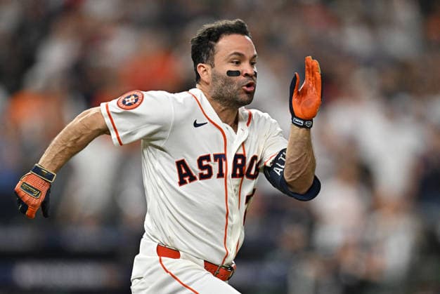 Houston Astros Jose Altuve (27) reaches first on an infield single to score Jeremy Pena against the Chicago White Sox in the eighth inning in an MLB, Baseball Herren, USA American League Wild Card game in Houston, Texas, on Tuesday, September 29, 2026.  HOU20260929742 MARIAxLYSAKER