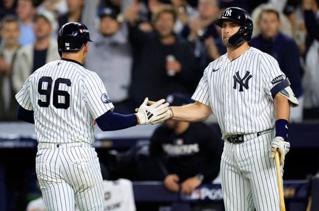 New York Yankees George Lombard Jr. (96) is congratulated by Paul Goldschmidt (48) as he scores on a single by Austin Wells in the second inning of an MLB, Baseball Herren, USA American League Wild Card game against the Boston Red Sox at Yankee Stadium in New York City, on Tuesday, September 29, 2026.  NYP20260929715 COREYxSIPKIN