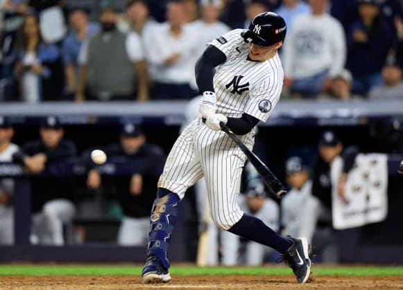 New York Yankees designated hitter Ben Rice (22) hits a grand slam home run in the eighth inning to give the Yankees a 9-0 lead over the Boston Red Sox in an MLB, Baseball Herren, USA American League Wild Card game at Yankee Stadium in New York City, on Tuesday, September 29, 2026.  NYP20260929730 COREYxSIPKIN