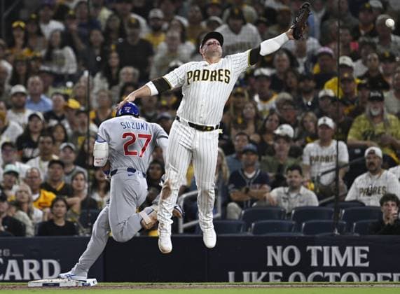 Baseball: Wild Card Series between Cubs and Padres Chicago Cubs right fielder Seiya Suzuki (L) reaches first base on a throwing error by San Diego Padres shortstop Xander Bogaerts in the second inning of Game 1 of the National League Wild Card Series at Petco Park in San Diego, California, on Sept. 29, 2026.  A14AA0005629417P