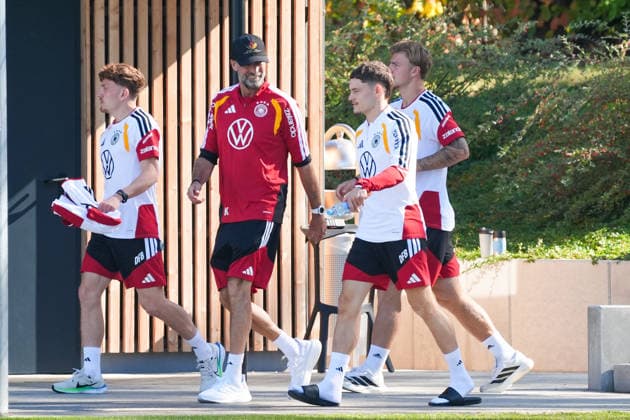National Team Coach Jürgen Klopp of Germany in conversation with Florian Wirtz of Germany at HerzoBase on September 30, 2026—German National Team, Nations League preparation, home ground, HerzoBase, World of Adidas, Herzogenaurach
