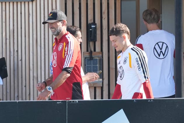 National Team Coach Jürgen Klopp of Germany in conversation with Florian Wirtz of Germany at HerzoBase on September 30, 2026—German National Team, Nations League preparation, home ground, HerzoBase, World of Adidas, Herzogenaurach