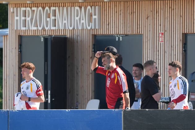 National Team Coach Jürgen Klopp of Germany in conversation with Florian Wirtz of Germany at HerzoBase on September 30, 2026—German National Team, Nations League preparation, home ground, HerzoBase, World of Adidas, Herzogenaurach