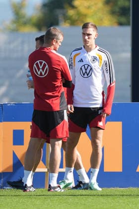 Assistant Coach Sven Bender (Germany) in conversation with Nico Schlotterbeck (Germany) at HerzoBase on September 30, 2026: German National Team, Nations League preparation, home ground, HerzoBase, World of Adidas, Herzogenaurach
