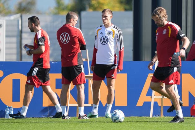 Assistant Coach Sven Bender (Germany) in conversation with Nico Schlotterbeck (Germany) at HerzoBase on September 30, 2026: German National Team, Nations League preparation, home ground, HerzoBase, World of Adidas, Herzogenaurach