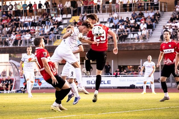 TSG Balingen vs. SSV Ulm 1846 Soccer, State Cup, WFV Cup, Round of 16, BIZERBA ARENA Balingen, September 30, 2026—First chance of the game (from left): header by Benjamin Goller, SSV Ulm 1846 Soccer, 07, Jonas Fritschi, TSG Balingen soccer, 29 TSG Balingen vs. SSV Ulm 1846 soccer, soccer, State Cup, WFV Cup, Round of 16, BIZERBA ARENA, Balingen, September 30, 2026; Photo by Lucca Fundel, Balingen, BIZERBA ARENA, Baden-Württemberg, Germany