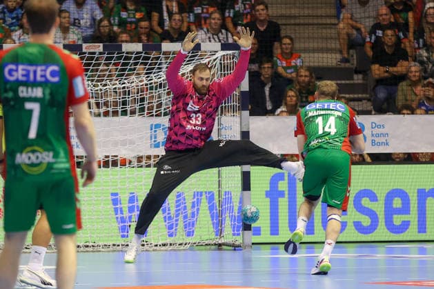 September 30, 2026, xgox, Opel HBL Handball, SC Magdeburg vs. THW Kiel (emspor), from left: Andreas Wolff (Kiel), 33, Omar Ingi Magnusson (Magdeburg), 14 (Magdeburg)