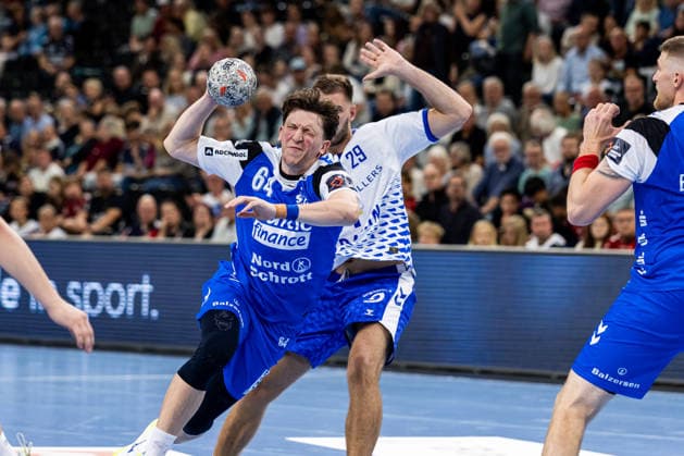 FLENSBURG, GERMANY - SEPTEMBER 30: Lasse Kjaer Moller (SG Flensburg-Handewitt, 64) against Guillermo JosÃ Fischer (Fraikin BM. Granollers, 29) during the EHF European League match between SG Flensburg-Handewitt vs Fraikin BM. Granollers at GGW Arena on matchday 1 of the Group Matches Group E on September 30, 2026 in Flensburg, Germany. Schleswig-Holstein Germany Copyright: xMarioxM.xKobergx