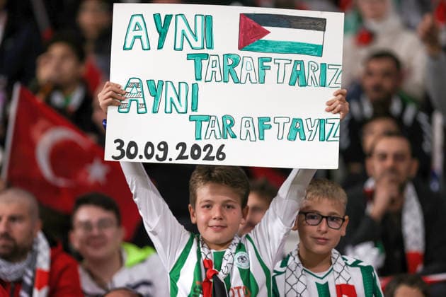 Konyaspor v Palestine - Friendly KONYA, TURKIYE - SEPTEMBER 30: A child holds a banner reading We Are the Same Fans, We Are on the Same Side in the stands as spectators support both teams during a friendly match between Konyaspor and the Palestine National Football Team as part of Palestine Day events at Konya Metropolitan Municipality Stadium in Konya, Turkiye on September 30, 2026. Serhat Çetinkaya Anadolu Konya Turkey. Editorial use only. Please get in touch for any other usage.  Copyright: x2026xAnadoluxSerhatxÃ‡etinkayax