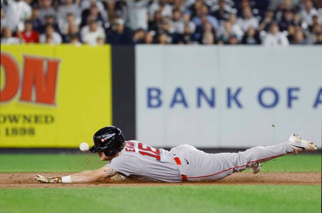 Boston Red Sox Nate Eaton (18) slides safely into second base for a double against the New York Yankees in the third inning of an MLB, Baseball Herren, USA American League Wild Card game at Yankee Stadium in New York City, on Wednesday, September 30, 2026.  NYP20260930705 JOHNxANGELILLO