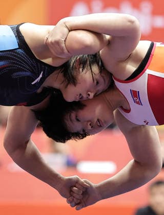 (261001) -- NAGOYA, Oct. 1, 2026 -- Zhang Qi (L) of China competes with Kim Ok Ju of the Democratic People s Republic of Korea (DPRK) during their Women s 62kg Semifinal bout of Wrestling at the 20th Asian Games Aichi-Nagoya 2026 in Nagoya, Japan, Oct. 1, 2026 ) (SP)JAPAN-NAGOYA-ASIAN GAMES-WRESTLING-WOMEN S 62KG-SEMIFINALS LongxLei 