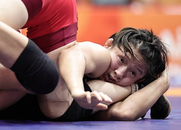 (261001) -- NAGOYA, Oct. 1, 2026 -- Zhang Qi of China competes with Kim Ok Ju of the Democratic People s Republic of Korea (DPRK) during their Women s 62kg Semifinal bout of Wrestling at the 20th Asian Games Aichi-Nagoya 2026 in Nagoya, Japan, Oct. 1, 2026 ) (SP)JAPAN-NAGOYA-ASIAN GAMES-WRESTLING-WOMEN S 62KG-SEMIFINALS LongxLei 