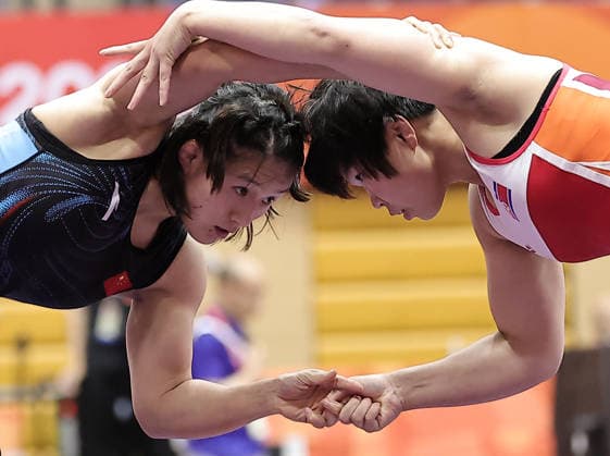 (261001) -- NAGOYA, Oct. 1, 2026 -- Zhang Qi (L) of China competes with Kim Ok Ju of the Democratic People s Republic of Korea (DPRK) during their Women s 62kg Semifinal bout of Wrestling at the 20th Asian Games Aichi-Nagoya 2026 in Nagoya, Japan, Oct. 1, 2026 ) (SP)JAPAN-NAGOYA-ASIAN GAMES-WRESTLING-WOMEN S 62KG-SEMIFINALS LongxLei 