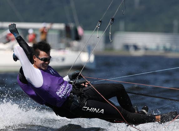 (261001) -- GAMAGORI, Oct. 1, 2026 -- Liu Tian (front) and Wen Zaiding of China celebrate after the Men s Skiff Opening Series Race of Sailing at the 20th Asian Games Aichi-Nagoya 2026 in Gamagori of Aichi Prefecture, Japan, Oct. 1, 2026. ) (SP)JAPAN-GAMARORI-ASIAN GAMES-SAILING-MEN S SKIFF DengxHua 