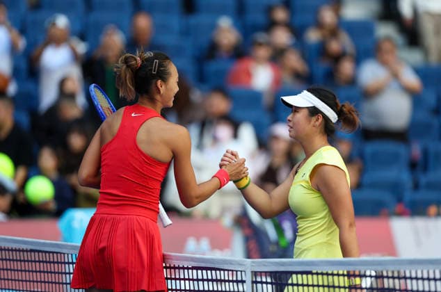 (261001) -- BEIJING, Oct. 1, 2026 -- Zheng Qinwen (L) of China and Shi Han of China shake hands after the women s singles first round match between Zheng Qinwen of China and Shi Han of China at 2026 China Open tennis tournament in Beijing, China, Oct. 1, 2026. ) (SP)CHINA-BEIJING-TENNIS-CHINA OPEN-WOMEN S SINGLES(CN) BaixXuefei 