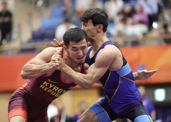 (261001) -- NAGOYA, Oct. 1, 2026 -- Kyrgyzstan s Zholoman Sharshenbekov (L) competes against Uzbekistan s Alisher Ganiev during their Men s Greco-Roman 60kg Final Bout of Wrestling at the 20th Asian Games Aichi-Nagoya 2026 in Nagoya, Japan, Oct. 1, 2026. ) (SP)JAPAN-NAGOYA-ASIAN GAMES-WRESTLING-MEN S GRECO-ROMAN 60KG LongxLei 