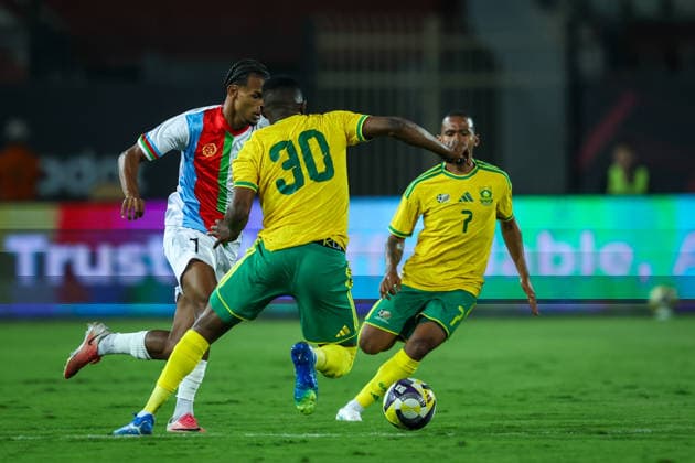Eritrea v South Africa - CAF Africa Cup Of Nations Qualifiers Filmon Gebregziabhier Rezene of Eritrea battles for possession with Oswin Reagan Appollis and Bathusi Jurry Aubaas of South Africa during the CAF Africa Cup of Nations qualifiers match between Eritrea and South Africa at Al Salam Stadium on September 30, 2026. Cairo Egypt  Copyright: xAymanxArefx originalFilename:aref-notitle260930_npG39.jpg