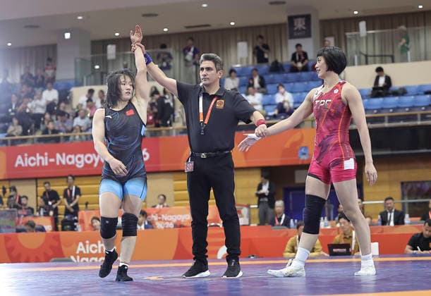 (261001) -- NAGOYA, Oct. 1, 2026 -- Zhang Qi (L) of China is announced winner after defeating Pai Hsin-ping of Chinese Taipei during the women s 62kg bronze medal match of Wrestling at the 20th Asian Games Aichi-Nagoya 2026 in Nagoya, Japan, Oct. 1, 2026. ) (SP)JAPAN-NAGOYA-ASIAN GAMES-WRESTLING-WOMEN S 62KG LongxLei 