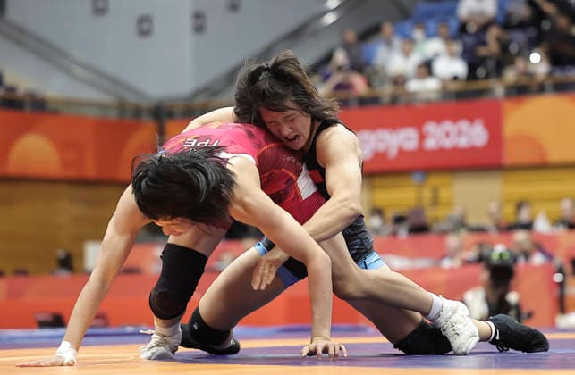 (261001) -- NAGOYA, Oct. 1, 2026 -- Zhang Qi (R) of China competes with Pai Hsin-ping of Chinese Taipei during the women s 62kg bronze medal match of Wrestling at the 20th Asian Games Aichi-Nagoya 2026 in Nagoya, Japan, Oct. 1, 2026. ) (SP)JAPAN-NAGOYA-ASIAN GAMES-WRESTLING-WOMEN S 62KG LongxLei 