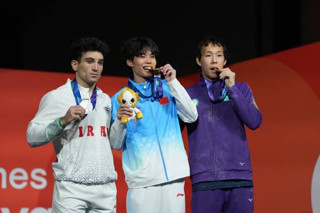 (261001) -- NAGOYA, Oct. 1, 2026 -- Gold medalist Chu Shouhong (C) of China, silver medalist Reza Ali Pour Shenazandi Fard of Iran (L) and Damir Toktarov of Kazakhstan pose during the awarding ceremony for the men s speed 4 final of climbing at the 20th Asian Games Aichi-Nagoya 2026 in Nagoya, Japan, Oct. 1, 2026. ) (SP)JAPAN-NAGOYA-ASIAN GAMES-SPORT CLIMBING-MEN-SPEED 4 FINAL JiaxYuchen 