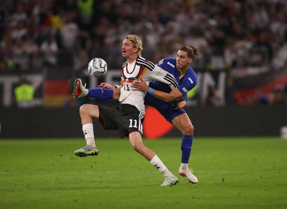 Germany vs. Serbia, soccer, men s, 2026–2027 season, international match, Nations League, Matchday 3, League A, Group 2, Allianz Arena: Nick Woltemade (Germany, left) and Srdan Babic (Serbia, right) battle for the ball