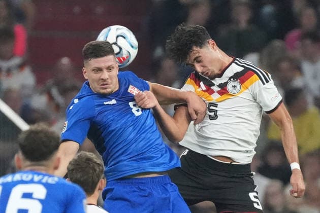 Heading duel: Luka Jovic (Serbia) vs. Aleksandar Pavlovic (Germany), Munich, October 1, 2026; Germany vs. Serbia, UEFA Nations League, Matchday 3, Allianz Arena