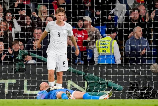 Soccer, Nations League: Wales vs. Norway, Nations League in Cardiff, Wales 20261001 Norway’s Orjan Haskjold Nyland lies on the ground in pain after the 1-1 draw in the international soccer match between Wales and Norway in the Nations League at Cardiff City Stadium. Photo: Lise Aserud, NTB, Cardiff, Wales. EDITORIAL USE ONLY. RESTRICTED USE FOR BETBETTING COMPANIES  Copyright: xLisexAserudxx xNTBx