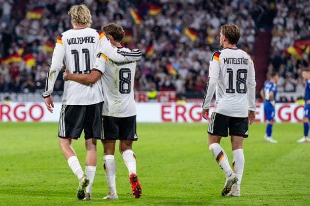 Nick Woltemade (Germany, 11) celebrates with Tom Bischof (Germany, 08) after his goal to make it 1–0; on the right, Maximilian Mittelstaedt (Germany, 18). Germany vs. Serbia, soccer, UEFA Nations League, League A group stage, Matchday 3, 2026–2027 season, October 1, 2026. DFL and DFB regulations prohibit any use of photographs as image sequences and or quasi-video. Photo: HMB Media, Heike Feiner Copyright: HMBxMedia HeikexFeiner