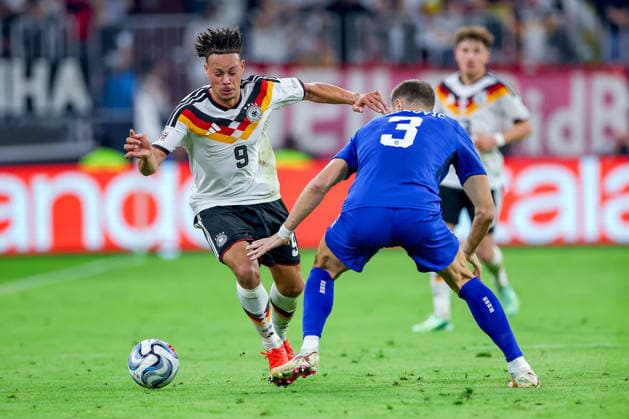 October 1, 2026, Soccer, International Match, Germany vs. Serbia, 2026–2027 UEFA Nations League, Matchday 3, Allianz Arena, Munich, 2026–27 season: Derry Scherhant (GER 9) in a tackle against Strahinja Pavlovic (SER 3). DFB regulations prohibit any use of photographs as image sequences and or quasi-video. Bayern Munich, Germany