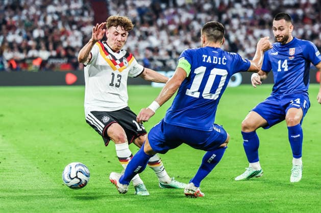 Sports, Soccer, UEFA Nations League 2026–2027 Season, Group A2, Matchday 3: Germany vs. Serbia, October 1, 2026, Allianz Arena; Philipp Treu (Germany), No. 13; Dusan Tadic (Serbia), No. 10; Munich, Allianz Arena, Bavaria, Germany