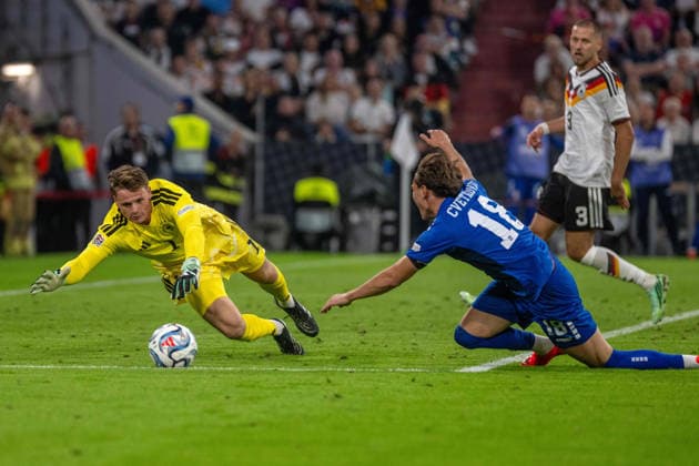 Jonas Urbig (GER) and Mihajlo Cvetkovic (SRB), xettx, Germany, Munich, October 1, 2026, soccer, national team, Nations League: Germany vs. Serbia, 2026–2027 season, Matchday 3, Allianz Arena
