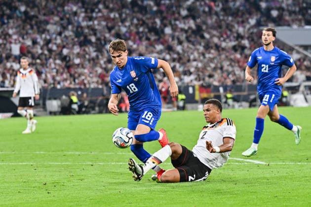 MUNICH, GERMANY; 01. OCTOBER: tackle between Mihajlo CVETKOVIC (Serbia 18) and Malick THIAW (Germany 2) during the UEFA Nations League Match between Germany vs. Serbia at Matchday 3 at Allianz Arena Copyright: xBEAUTIFULxSPORTS Goldbergx