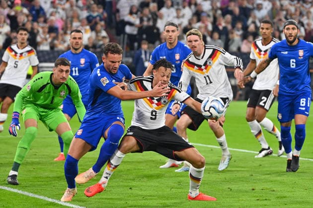 Derry SCHERHANT (GER) in action, one-on-one against Strahinja ERAKOVIC (SRB) in the penalty area during the UEFA Nations League group stage, Group B, Matchday 3: Germany (GER) vs. Serbia (SRB) 2–0 on October 1, 2026, at the Allianz Arena