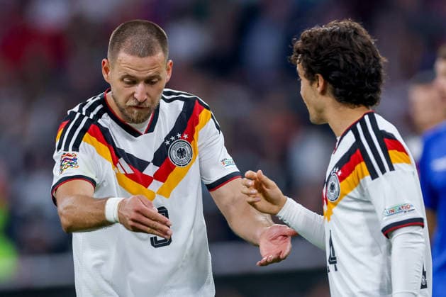 October 1, 2026, Soccer, International Match, Germany vs. Serbia, UEFA Nations League 2026–2027, Matchday 3, Allianz Arena, Munich, 2026–27 season. Waldemar Anton (GER 3) gesturing on the field next to Mika Baur (GER 14). DFB regulations prohibit any use of photographs as image sequences and or quasi-video. Bayern Munich, Germany