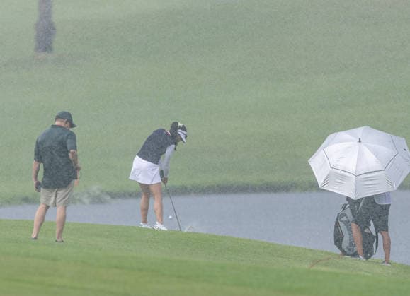 October 1, 2026, Honolulu, Hawaii, USA: BRITTANY FAN makes an approach shot on the 6th fairway in the rain at the 2026 Lotte Championship at Hoakalei Country Club, Ewa Beach, Hawaii, USA. Even though Hurricane Nolo had already passed Hawaii, its outer bands dropped bouts of heavy rain during Round 1. Honolulu USA - ZUMAm310 20261001_zsp_m310_021 Copyright: xElliotxMilesx