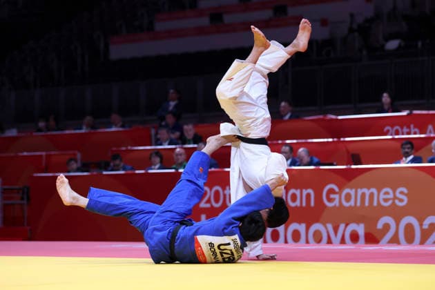 (261002) -- NAGOYA, Oct. 2, 2026 -- Huang Fuchun (top) of China vies with Ernazar Sarsenbaev of Uzbekistan during the men -100kg bronze medals match of Judo at the 20th Asian Games Aichi-Nagoya 2026 in Nagoya, Japan, Oct. 2, 2026. ) (SP)JAPAN-NAGOYA-ASIAN GAMES-JUDO-MEN-100KG YaoxQilin 