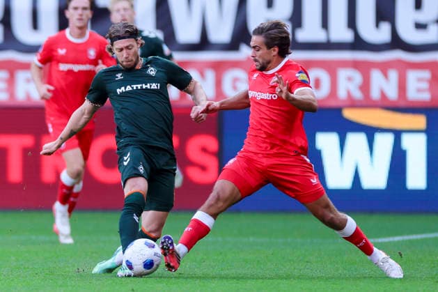 Mitchell Weiser of Werder Bremen and Bart van Rooij of FC Twente Enschede battle for the ball during the friendly match between FC Twente Enschede and Werder Bremen at De Grolsch Veste on October 2, 2026, in Enschede, Netherlands Photo by Marco Steinbrenner, DeFodi Images Mitchell Weiser of Werder Bremen and Bart van Rooij of FC Twente Enschede battle for the ball during the friendly match between FC Twente Enschede and Werder Bremen at De Grolsch Veste on October 2, 2026, in Enschede, Netherlands. Photo by Marco Steinbrenner, DeFodi Images. Photo by Marco Steinbrenner, DeFodi Images.