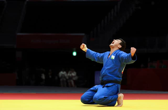 (261002) -- NAGOYA, Oct. 2, 2026 -- Muzaffarbek Turoboyev of Uzbekistan celebrates victory against Ota Hyoga of Japan after the men +100kg final of Judo at the 20th Asian Games Aichi-Nagoya 2026 in Nagoya, Japan, Oct. 2, 2026. ) (SP)JAPAN-NAGOYA-ASIAN GAMES-JUDO-MEN +100KG YaoxQilin 