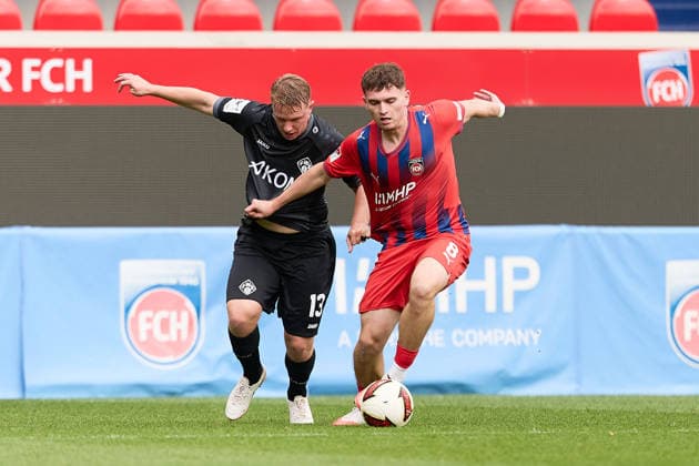 Head-to-head matchup between Philipp Ochs of FC Wuerzburger Kickers, 13, and Paul Hennrich of 1 FC Heidenheim, 08 (GER), 1 FC Heidenheim 1846 e.V. vs. FC Wuerzburger Kickers, soccer, men’s friendly matches, 2026–2027 season, October 2, 2026, GER, 1 FC Heidenheim 1846 e.V. vs. FC Würzburger Kickers, soccer, men’s friendly matches, 2026–2027 season, October 2, 2026, Heidenheim an der Brenz Copyright: xEibner-Pressefoto GeraldxOelze-dexStoppanyx EP_ODS