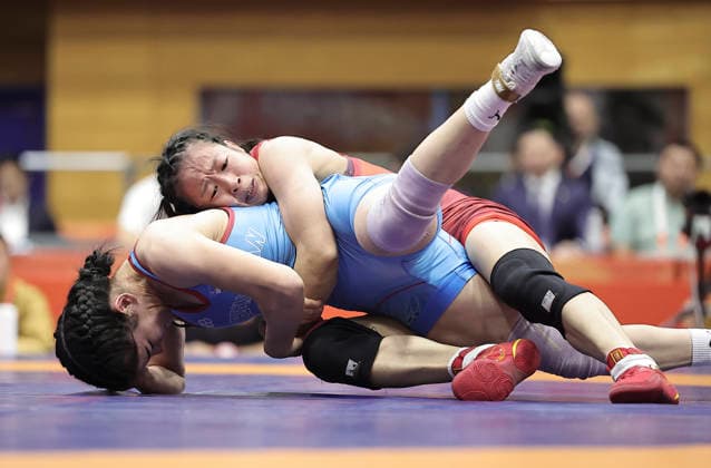 (261002) -- NAGOYA, Oct. 2, 2026 -- Feng Ziqi (top) of China competes with Aktenge Keunimjaeva of Uzbekistan during the women s 50kg bronze medals match of Wrestling at the 20th Asian Games Aichi-Nagoya 2026 in Nagoya, Japan, Oct. 2, 2026. ) (SP)JAPAN-NAGOYA-ASIAN GAMES-WRESTLING-WOMEN S 50KG LongxLei 